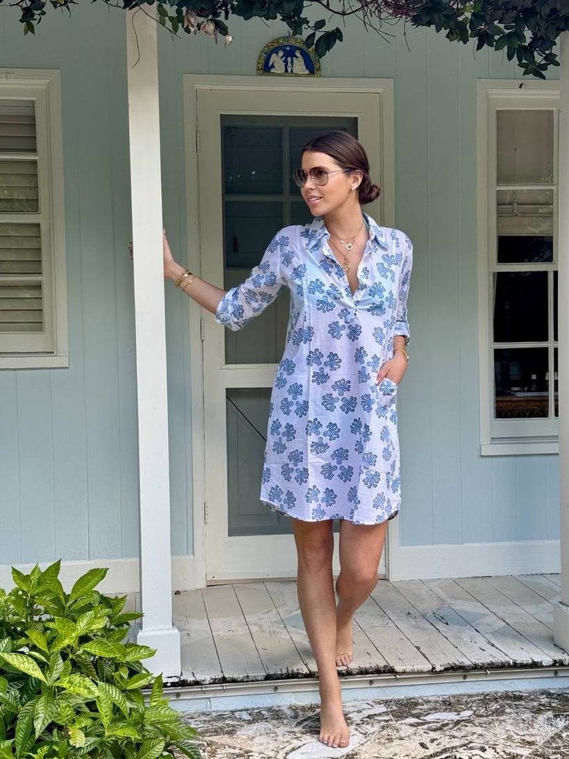 Full-length printed shirt dress on a porch
